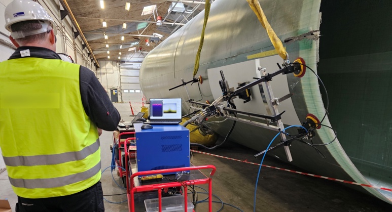 NORBLIS scanner mounted on a wind turbine blade during on-site coating inspection